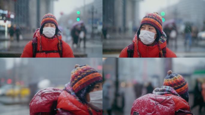 年轻的女性旅行者在冬天在城市里观光和过马路