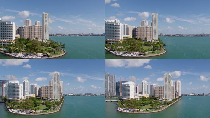 晴朗的一天，佛罗里达州迈阿密市中心布里克尔基岛周围比斯开湾的鸟瞰全景。无人机制作的视频剪辑具有向后和
