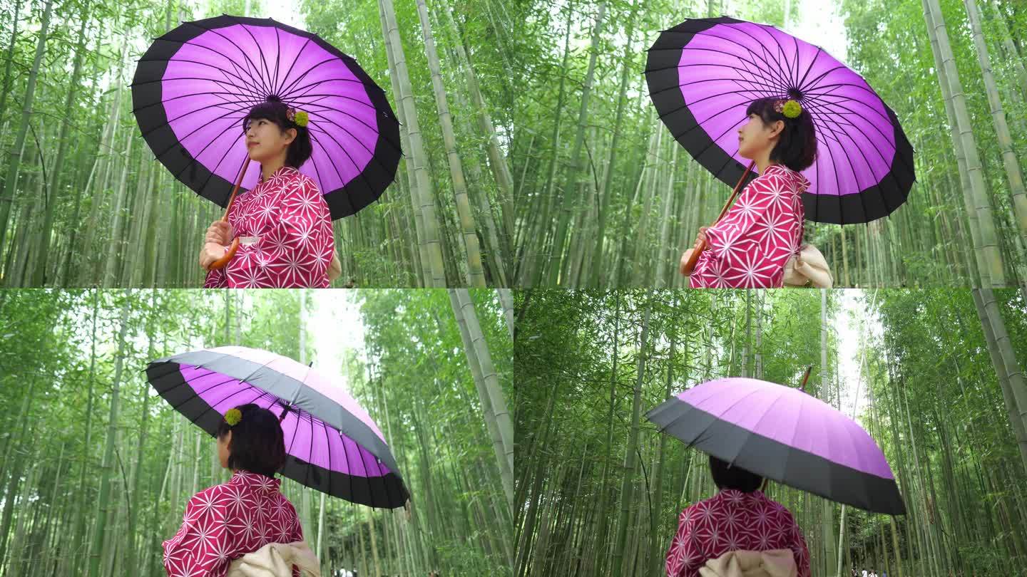 在京都的竹林中散步的年轻女子