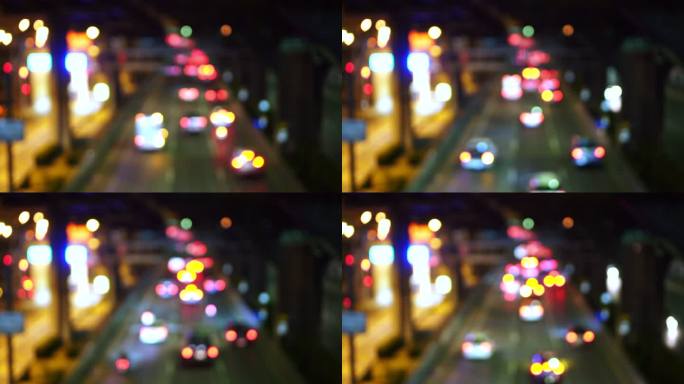 失焦背景与模糊的未聚焦城市灯光、行车灯和汽车灯光。