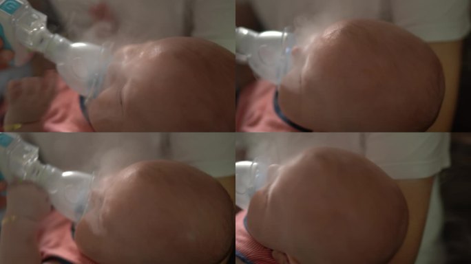 使用吸入器面罩的男婴吸入疗法