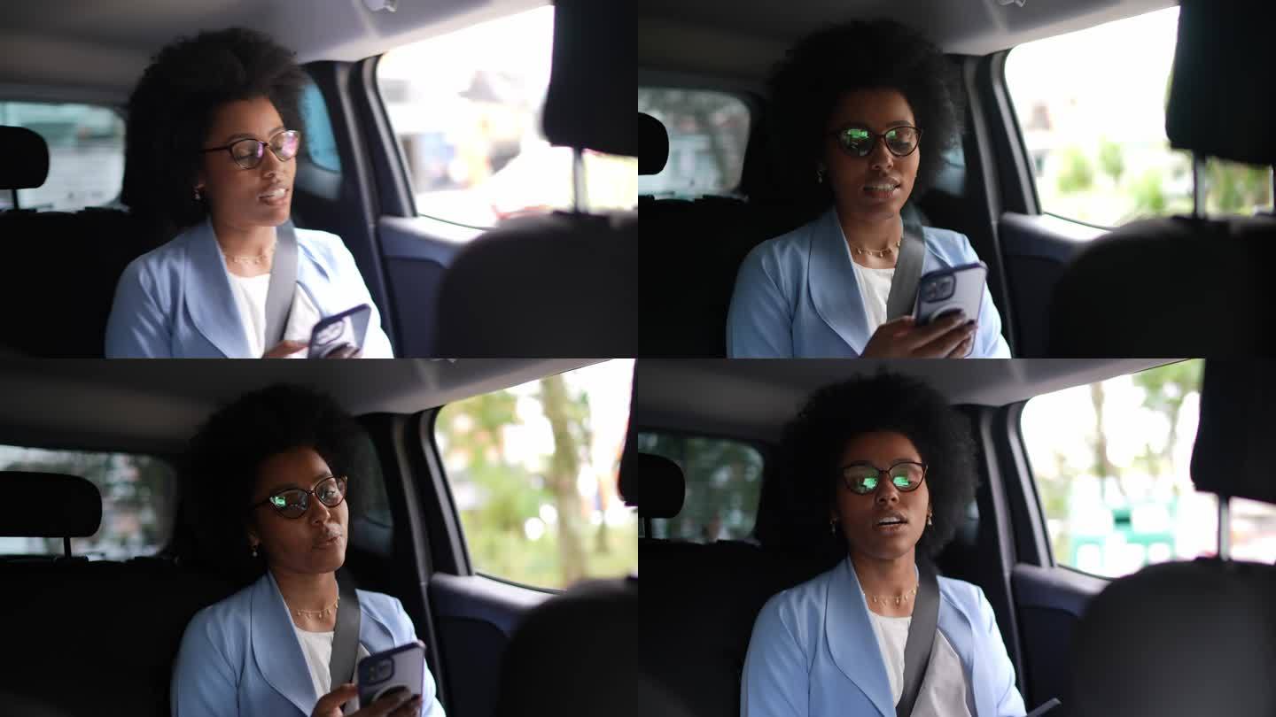 年轻女子使用手机与拼车司机交谈