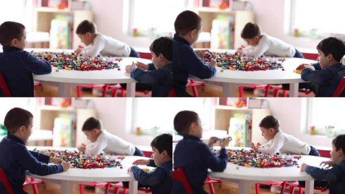 学龄前男孩在私立学校的游戏室玩塑料积木