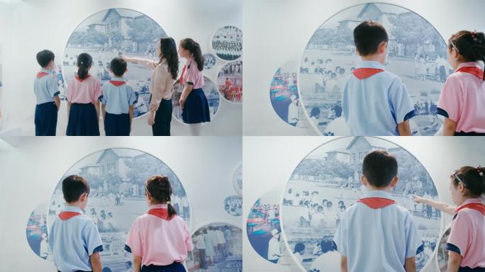小学教师带领小学生参观科学展览馆资料馆
