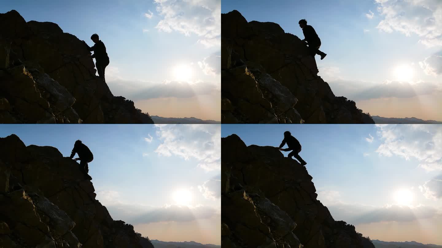 探险者逆光爬上山顶登山脚步攀登悬崖成功者