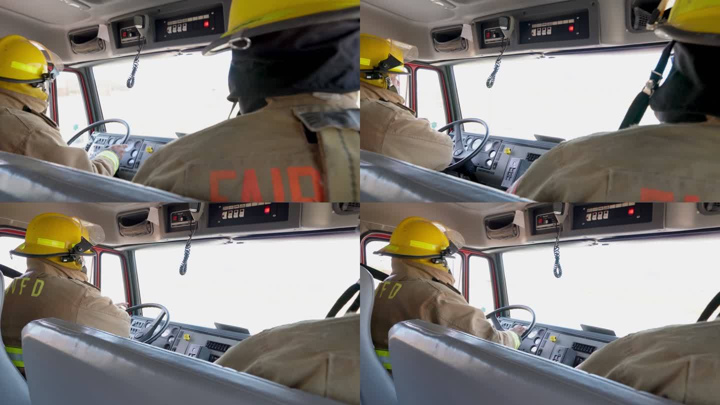 消防员驾驶消防车响应紧急情况，通过双向无线电通信