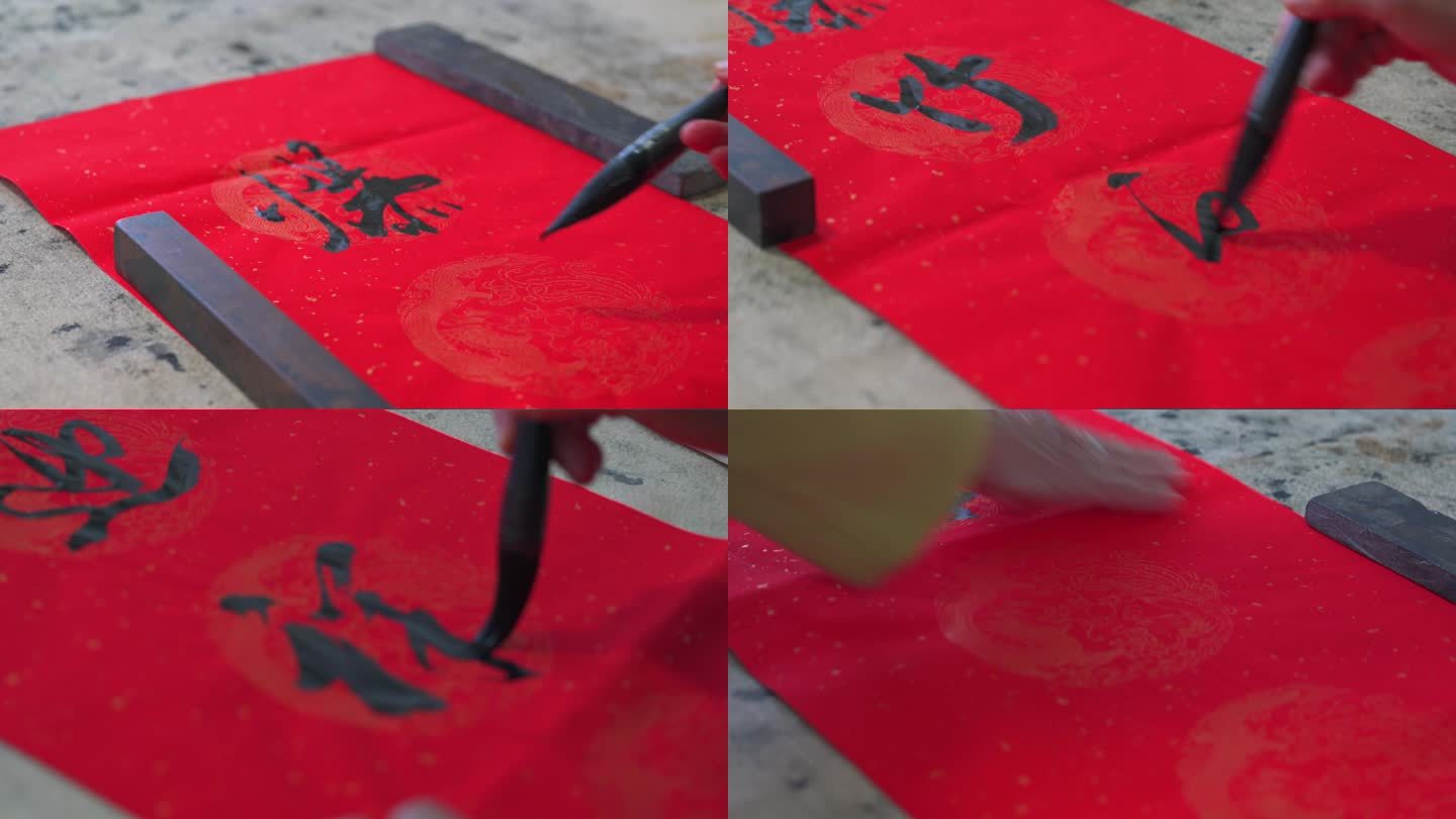一位老书法家在书写中国新年张贴的春联