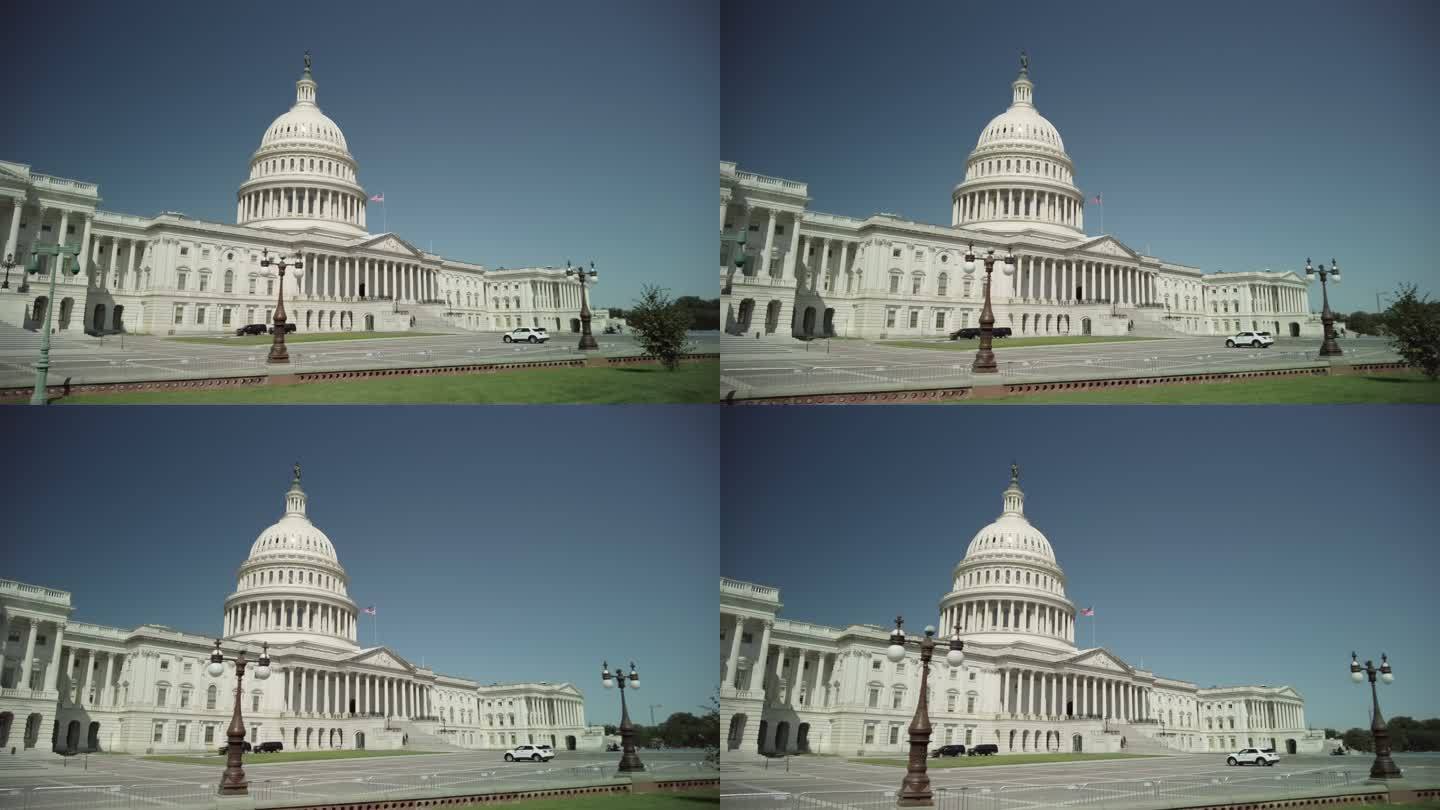 华盛顿特区美国国会大厦与美国国旗成低角度