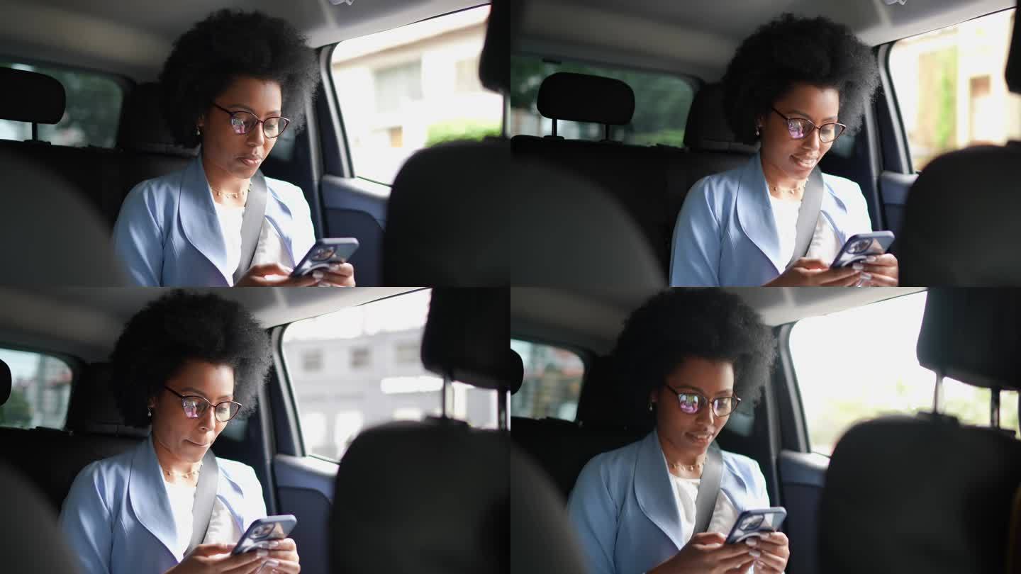 年轻女子在车上使用手机