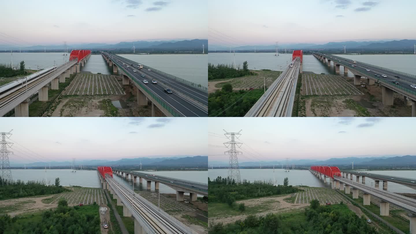 航拍官厅湖上的京张高铁和高速公路