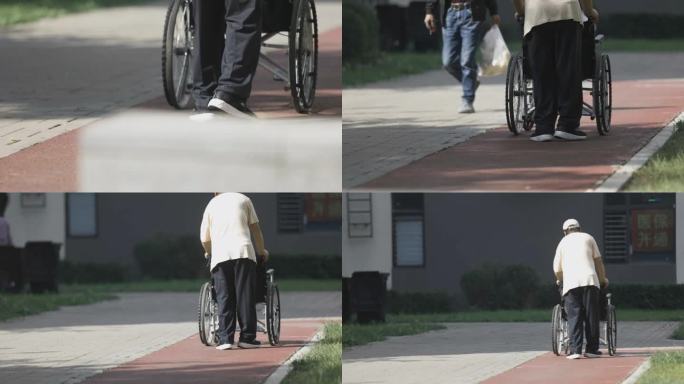 小区社区老人推着轮椅的背影腿脚不好