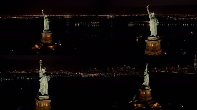 夜间以纽约为背景的自由女神像鸟瞰图
