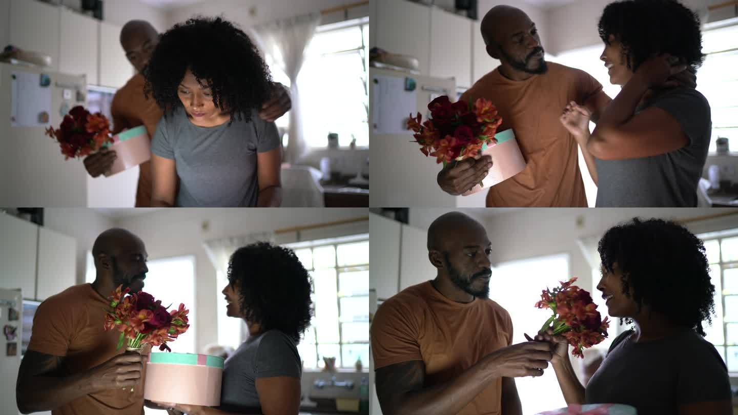 丈夫用鲜花和礼物给妻子惊喜