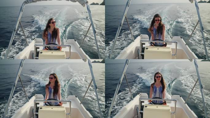 可爱而快乐的女孩驾驶快艇在梦中度假。愉快的微笑