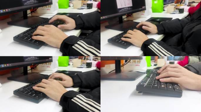 一个男子在办公室按键盘工作