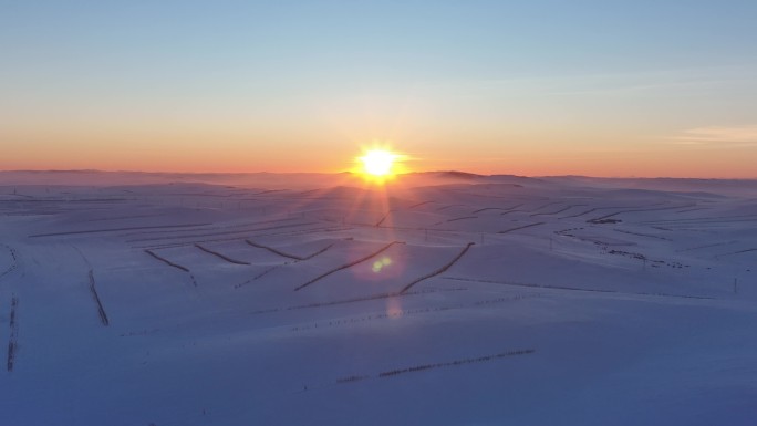 航拍呼伦贝尔草原雪景日落