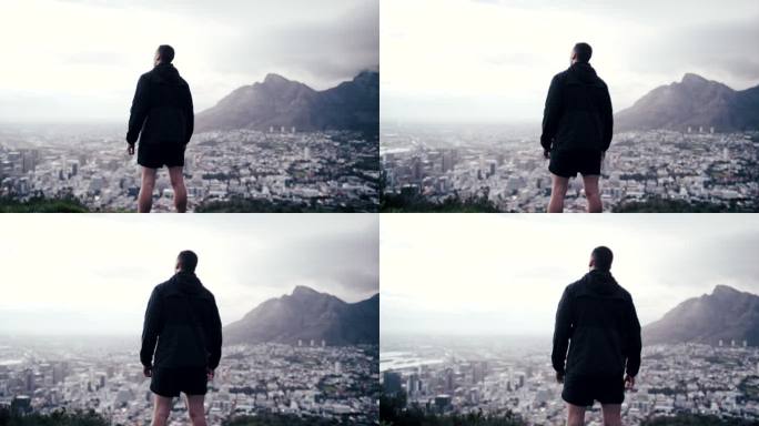 一名男子跑步前休息欣赏风景的4k视频片段
