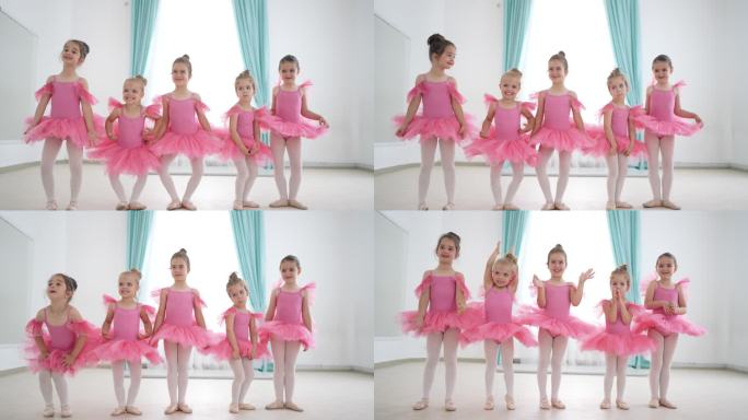 穿着粉色排练服的小芭蕾舞演员