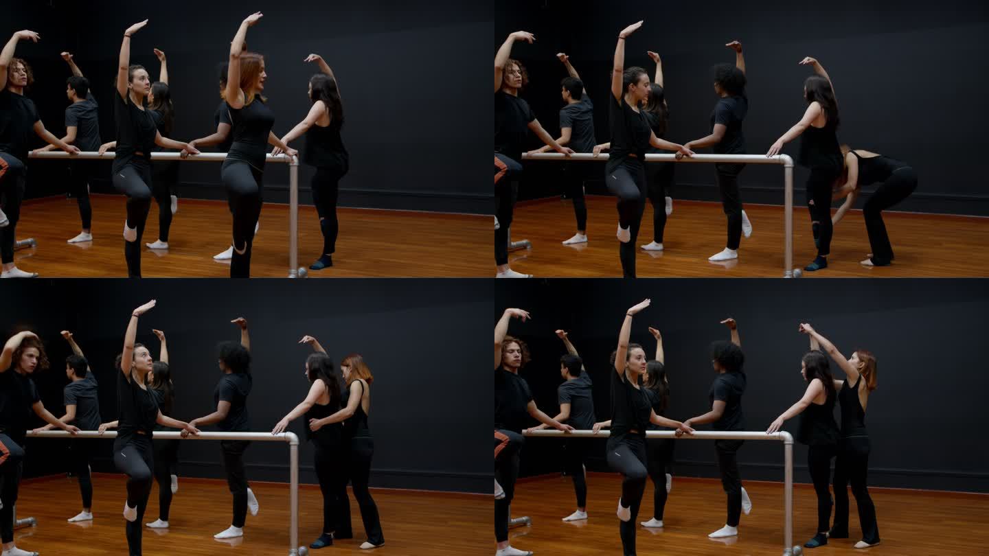 女芭蕾舞老师向全班展示正确的姿势，然后在学生们抓住双杠的时候绕着他们纠正