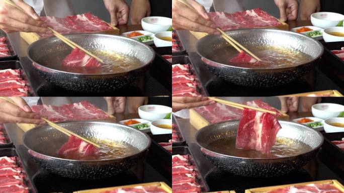 慢镜头：在火锅中烹饪涮牛肉。