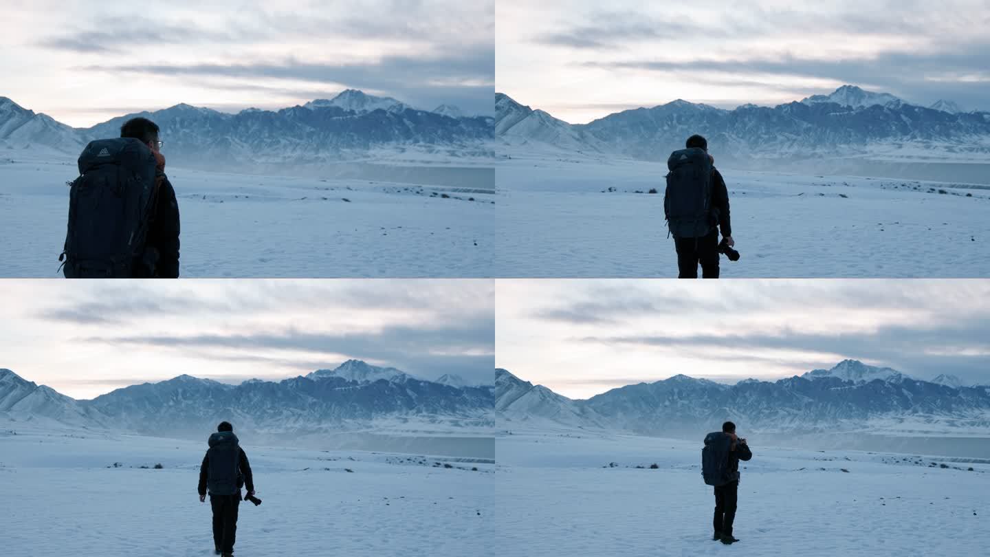 4K冰天雪地中行走的摄影师背影