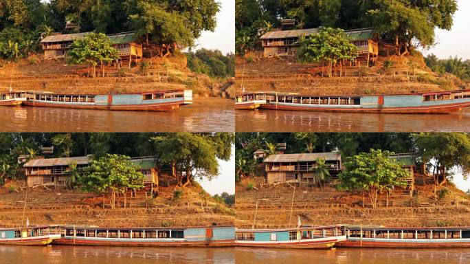 老挝琅勃拉邦传统湄公河游船和吊脚楼