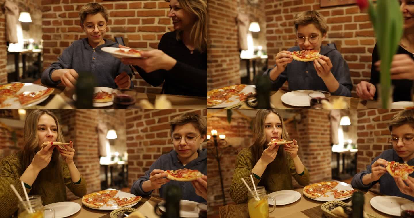 一家人享用披萨作为午餐
