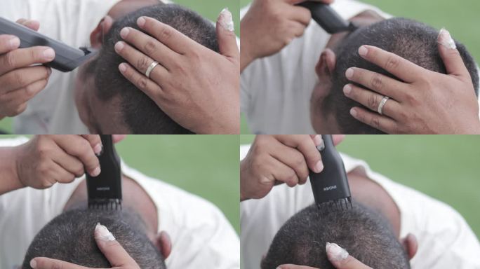 新冠肺炎大流行期间，一名男子在家剪自己的头发