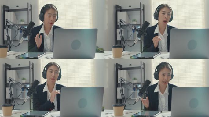 年轻的亚洲女商人在录音室的笔记本电脑上录制和广播播客。