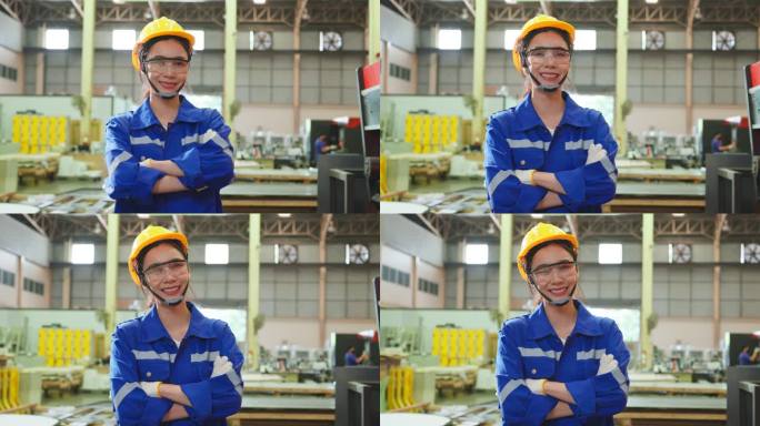 亚洲女性工业工人在工厂仓库工作的肖像。迷人的女工业工程师在制造厂独自处理订单和产品，然后微笑着看着镜