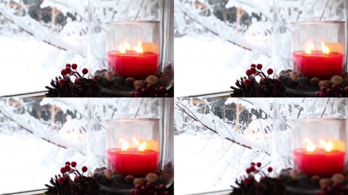 蜡烛和圣诞花环的细节，背后的雪林