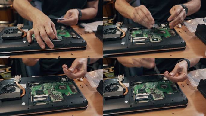车间男电子工程师拧螺丝维修电脑CPU