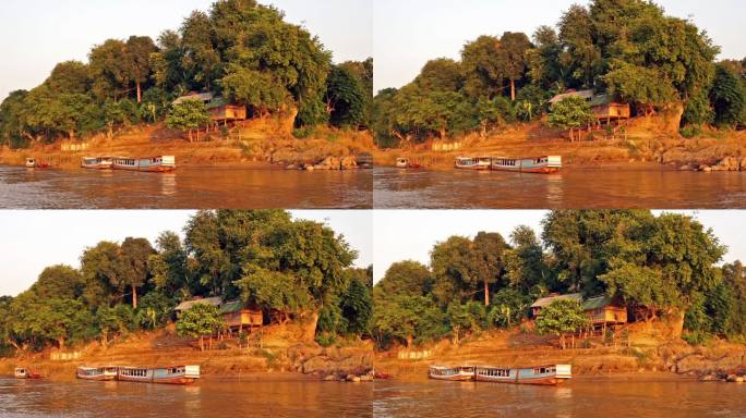 湄公河游船和吊脚楼，老挝琅勃拉邦