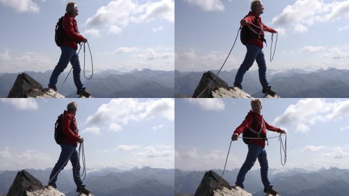 登山者在山顶上盘绕绳索