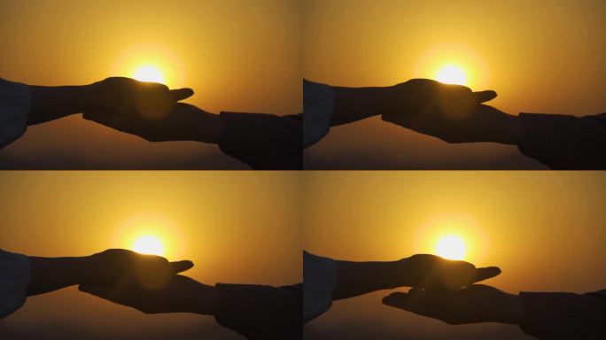 双手托起太阳保护自然公益广告逆光手部剪影
