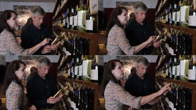 高级夫妇在葡萄酒店选购葡萄酒