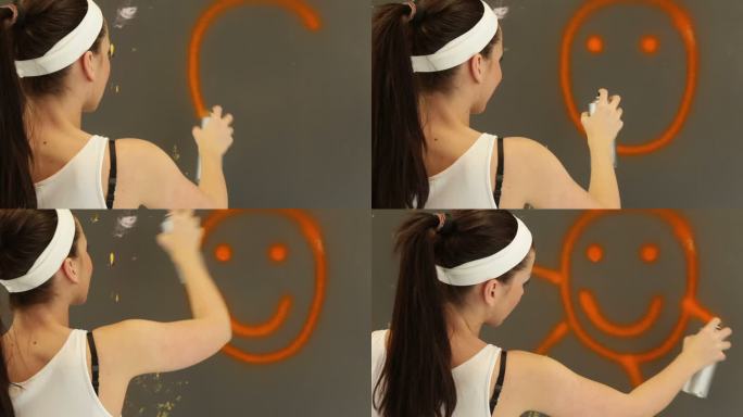 年轻女子画着幸福的微笑标志。