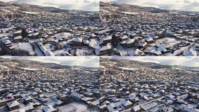 冬季鸟瞰雪山小镇。