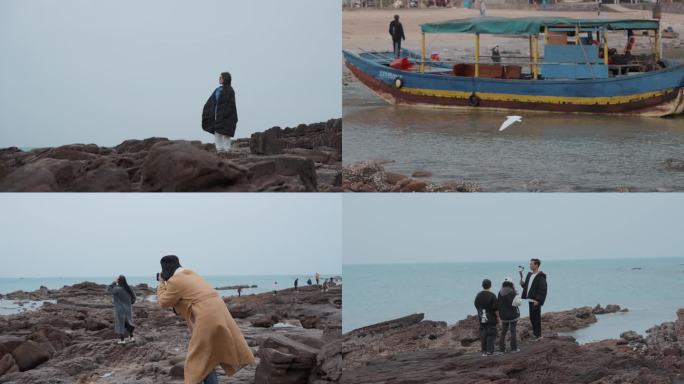 海边游客灯塔海鸥