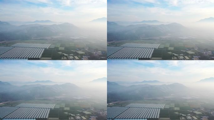 晨雾中的农田和太阳能发电站鸟瞰图