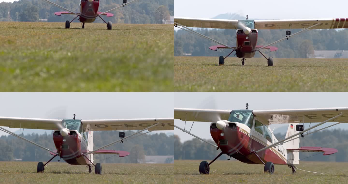 老式轻型飞机着陆时在阳光明媚的草地上移动