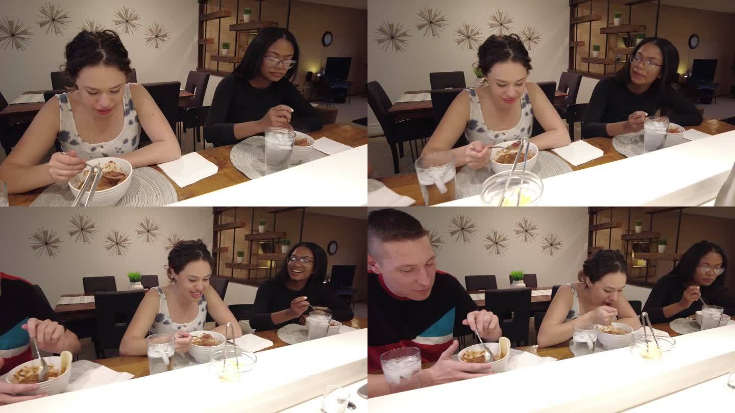 在美国西部烹饪辣椒和一起吃饭Z世代年轻人混合民族室内4K视频