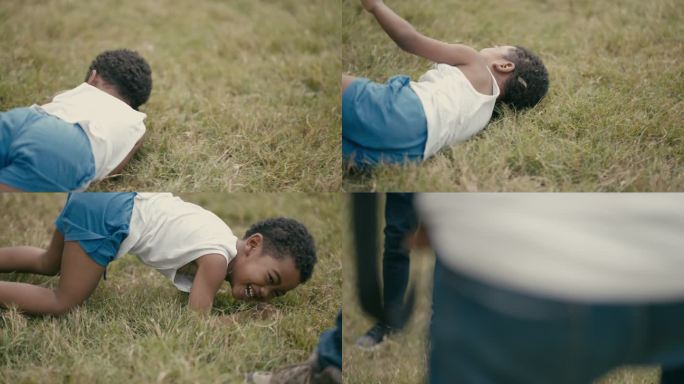 男孩躺在草地上转身