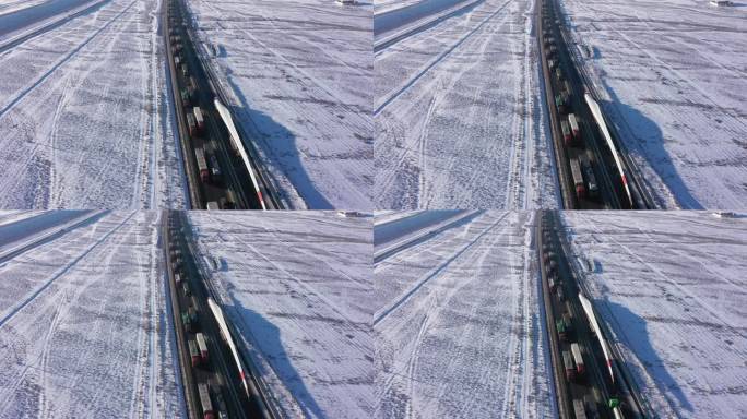 俯拍雪后高速公路风机叶片运送