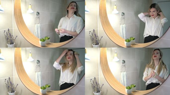 白人女商人在浴室镜子里观察自己