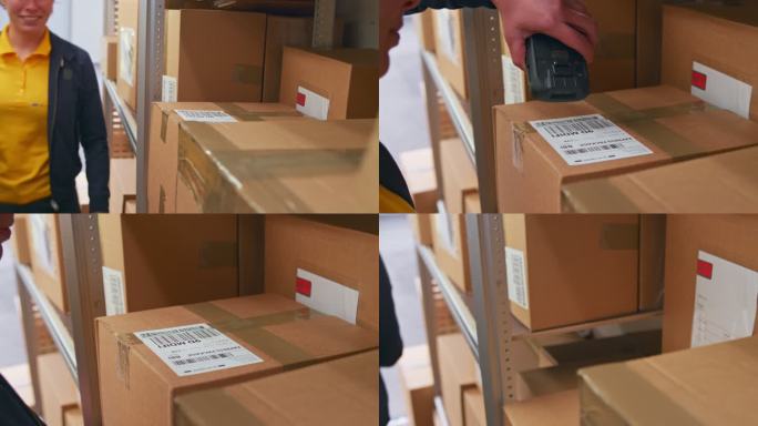 送货员扫描货车上的包裹并将其从货架上取下