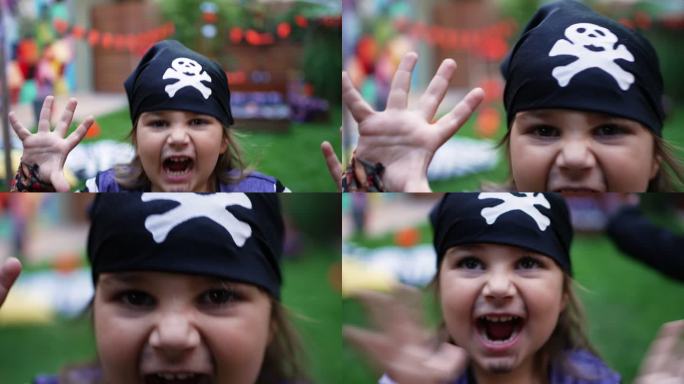 可怕的小海盗。万圣节穿海盗服装的小女孩