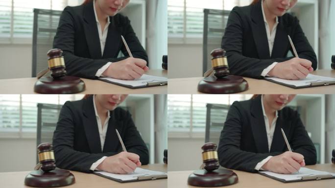 在办公室工作的女律师和公证员在文件上签字。顾问律师、司法和法律、律师、法院法官、概念。