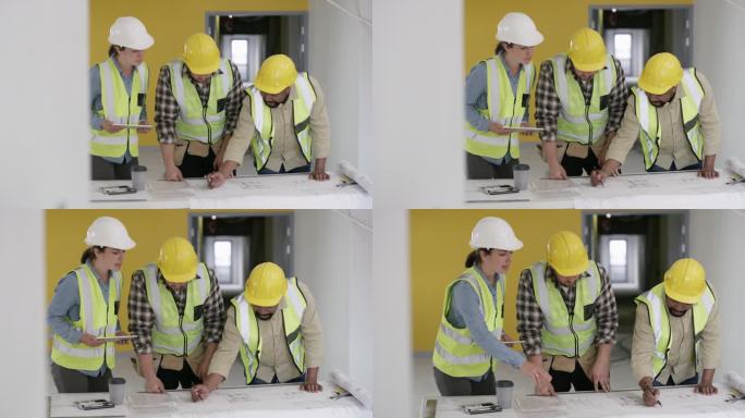 一组建筑工人在建筑工地开会的4k视频片段