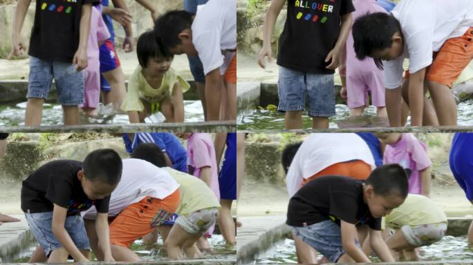 小孩子玩耍 水塘摸鱼